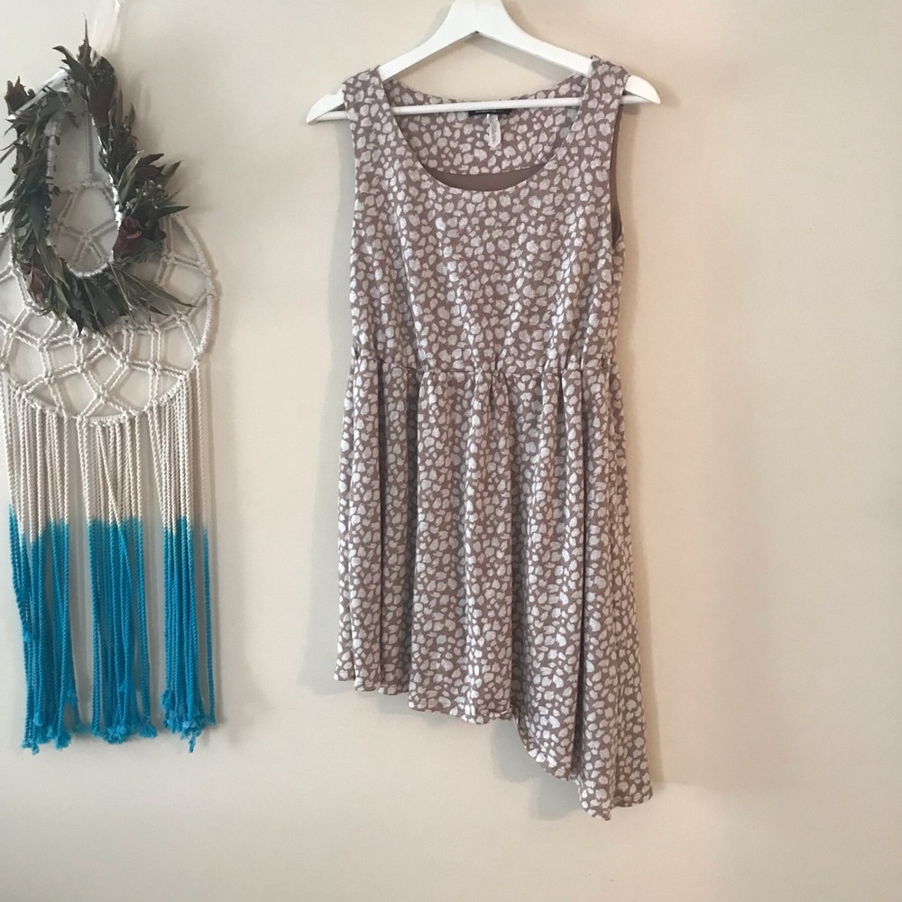 Asymmetrical beige and white petal print dress